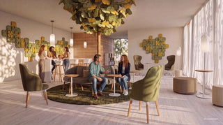 Photo d'ambiance d'un arbre acoustique BLOOM au-dessus d'un lounge avec fauteuils verts et personnes