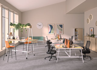 Lifestyle image of a Buronomic Quietude 104 cm sliding door cabinet in wire oak in an open office